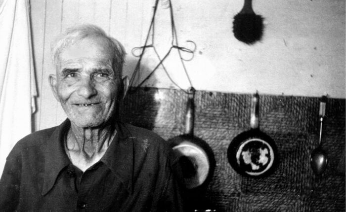 Black and white photo Sam with hangers